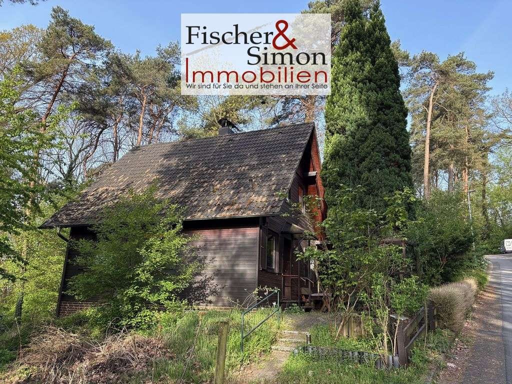 Immobilie in Steyerberg - Steyerberg- charmantes Holzhaus mit massivem Vollkeller in naturnaher, ruhiger Hanglage - Bild 1
