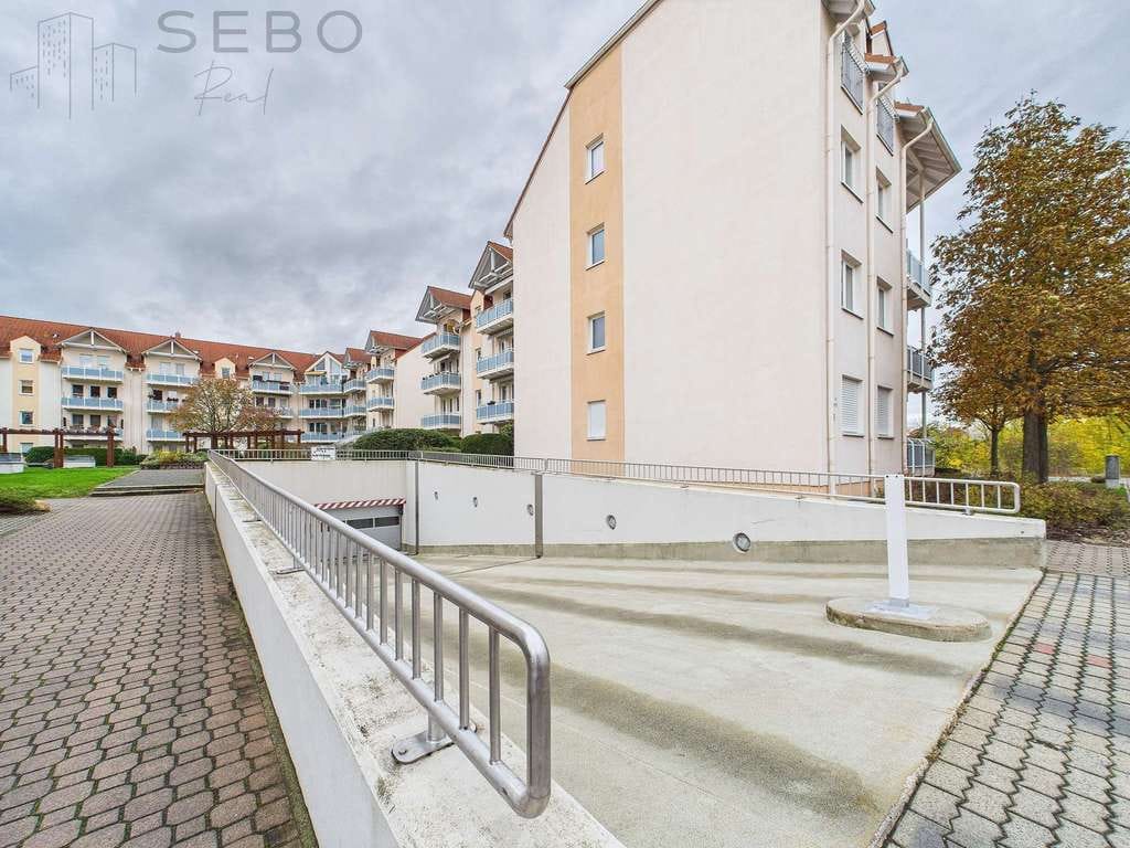 Immobilie in Borsdorf - Vermietete 2-Zimmer-Dachgeschosswohnung in grüner Lage von Borsdorf inkl. Tiefgarage - Bild 2