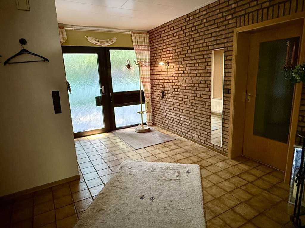 Immobilie in Coesfeld - Bungalow in ruhiger Sackgassenlage mit großem Westgrundstück, Keller und Garage - Bild 1