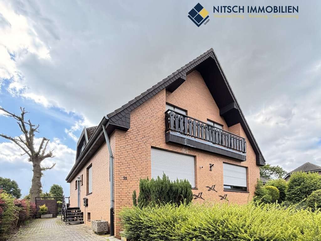 Immobilie in Geilenkirchen - Bungalow und Zweifamilienhaus mit großem Grundstück und vielfältigen Nutzungsmöglichkeiten - Bild 2