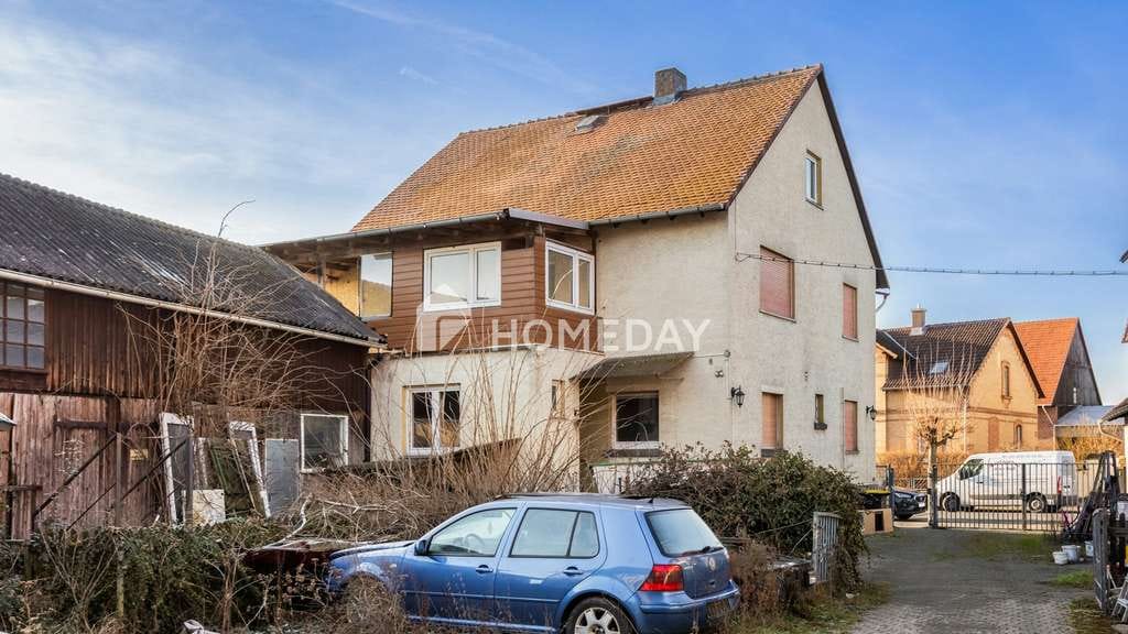Immobilie in Wölfersheim - Einfamilienhaus mit Stallungen, 8 Zimmern und großem Entwicklungspotenzial in ruhiger Lage - Bild 1