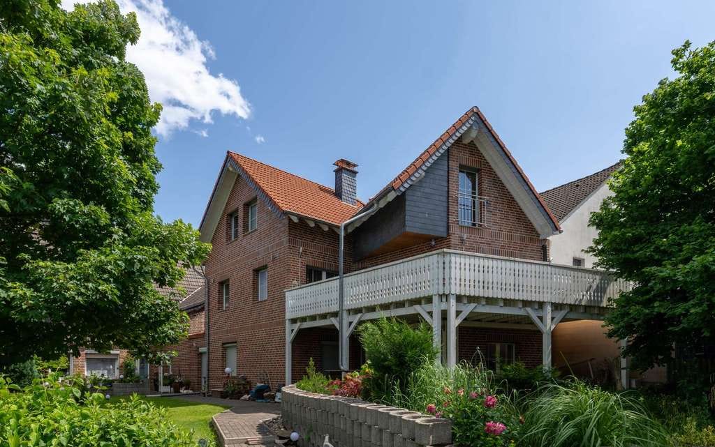 Immobilie in Nordkirchen - Charmantes 3-Häuser-Ensemble & Baugrundstück im Herzen von Südkirchen mit idyllischem Gartenparadies - Bild 1