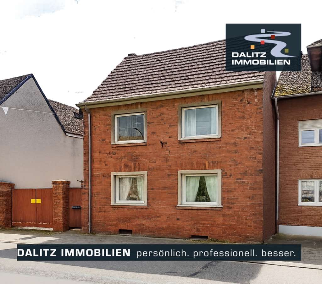 Immobilie in Zülpich - Vermietetes EFH mit großer Außenfläche - Bild 0
