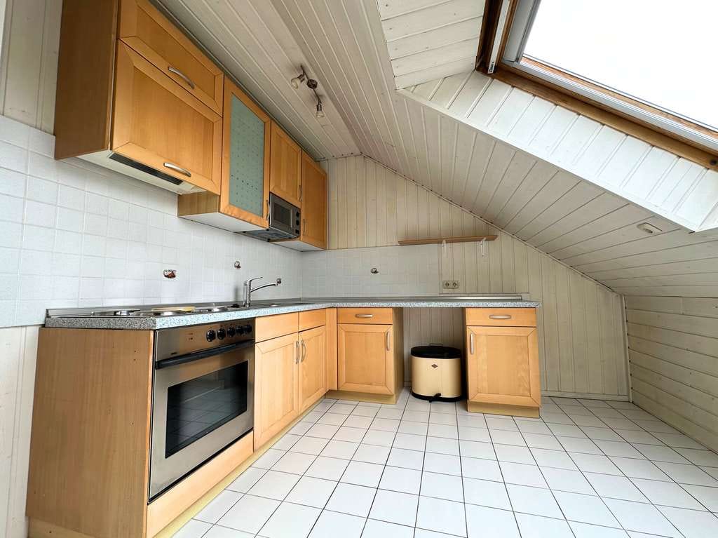 Immobilie in Ober-Olm - Großzügige Dachgeschosswohnung mit Westbalkon und Weitblick in Ober-Olm - Bild 1