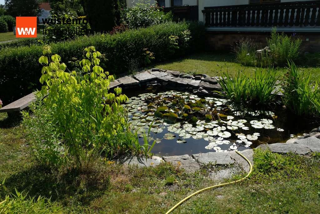 Immobilie in Nünchritz - Charmante DHH mit Teich, großer Terrasse & Kellergarage in ruhiger Lage von Nünchritz - Bild 2