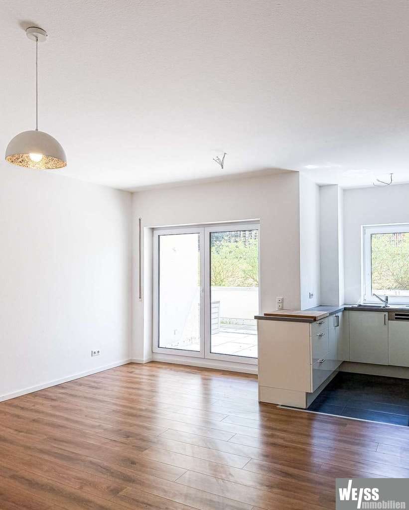 Immobilie in Marktheidenfeld - Neuwertige 3-Zimmer-Wohnung in unmittelbarer Nähe zum Main mit Tiefgaragen- und Außenstellplatz - Bild 1