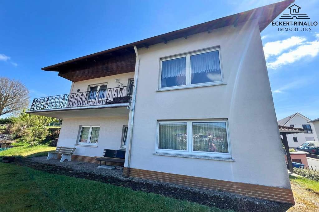 Immobilie in Lützelbach - Eckert-Rinallo Immobilien: Freistehendes Haus mit tollem Ausblick am Ortsrand von Seckmauern - Bild 1