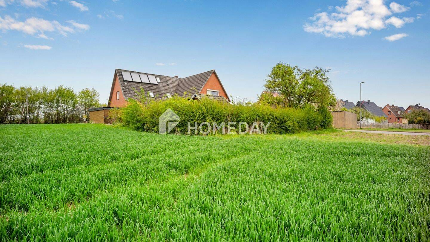 Immobilie in Börgerende-Rethwisch - Zweifamilienhaus mit ca. 300 m² Wohnfläche, Gartenidylle und vielseitigen Nutzungsmöglichkeiten - Bild 1