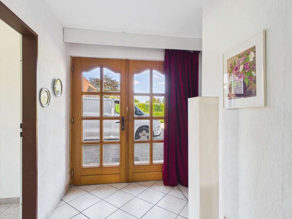 Immobilie in Hatten - Zweifamilienhaus mit laufenden Mieteinnahmen und freier Wohneinheit - Bild 1
