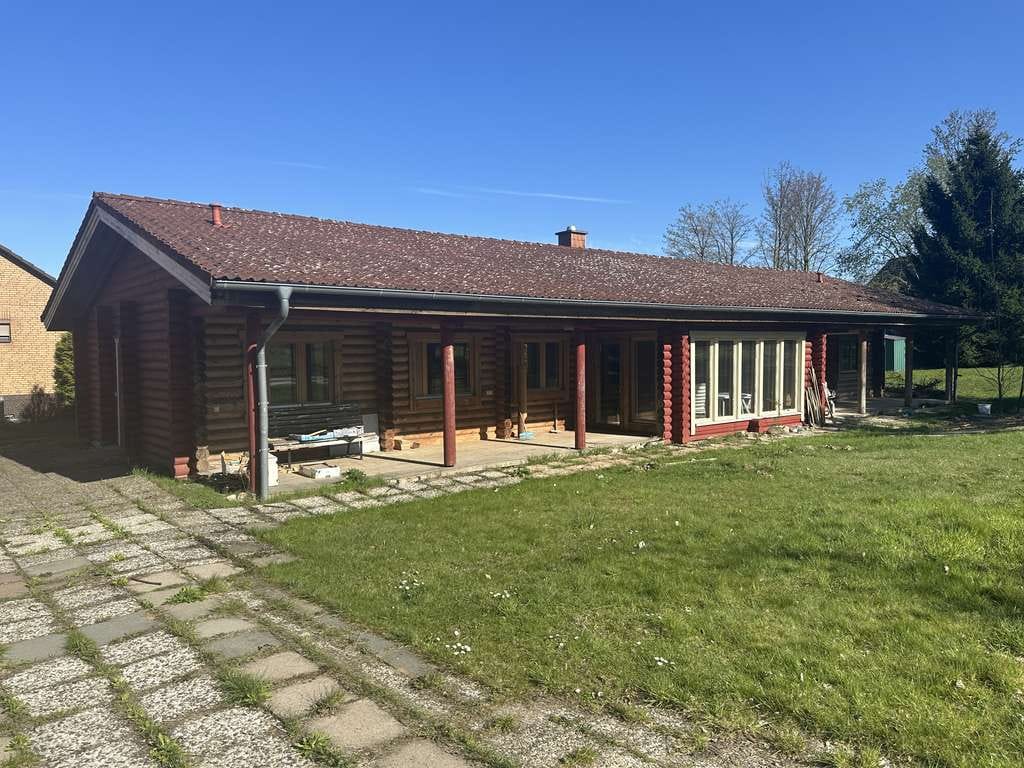 Immobilie in Hohenhameln - Skandinavischer Flair - EFH mit Doppelgarage in Blockbohlenbauweise auf großem Grundstück - Bild 2