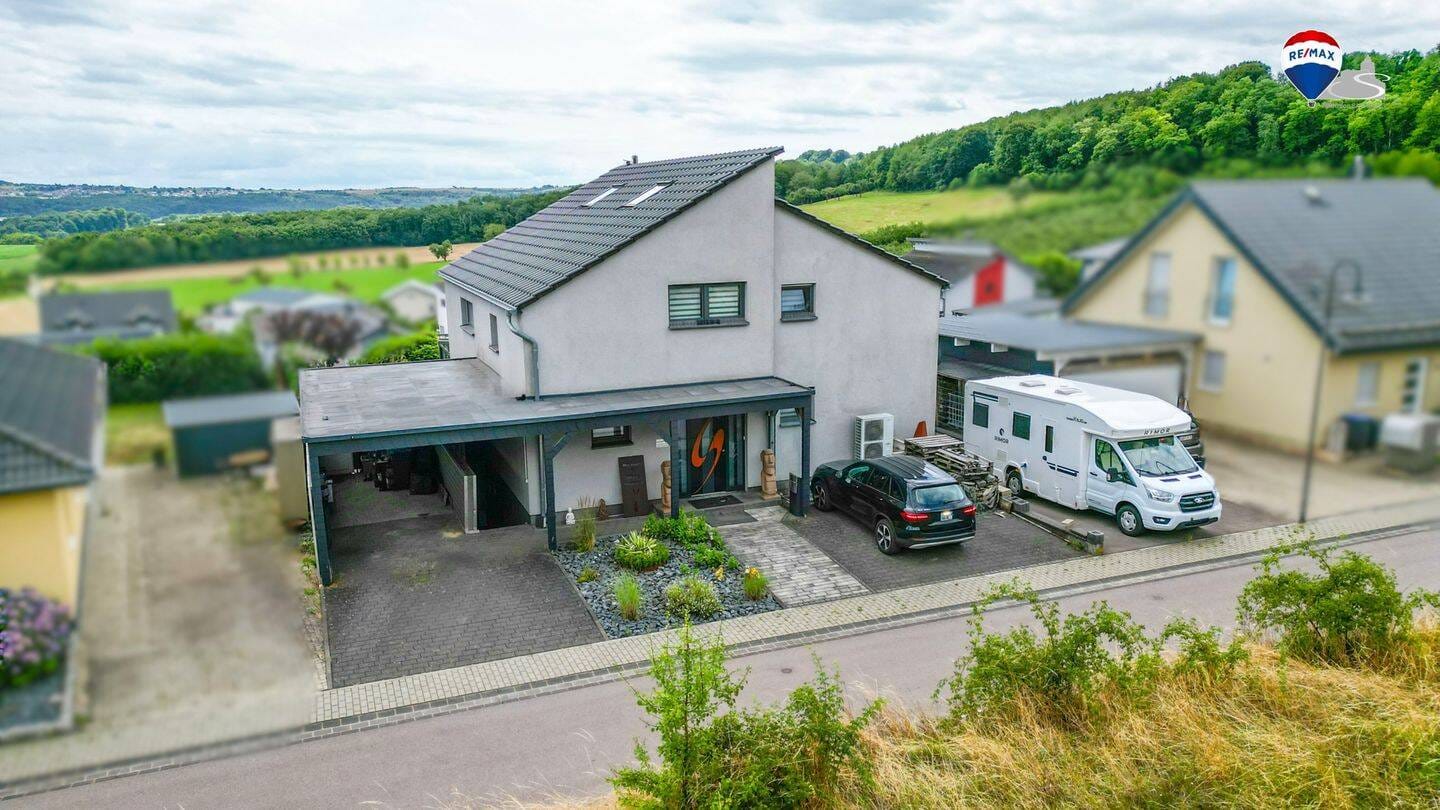 Immobilie in Kirf - Einziehen & wohlfühlen - modernes Zweifamilienhaus mit ELW & Wintergarten - Bild 0