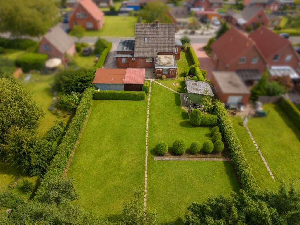 Immobilie in Großefehn - Charmantes Siedlerhaus in Ostgroßefehn – großes Grundstück & Nebengebäude! - Bild 2