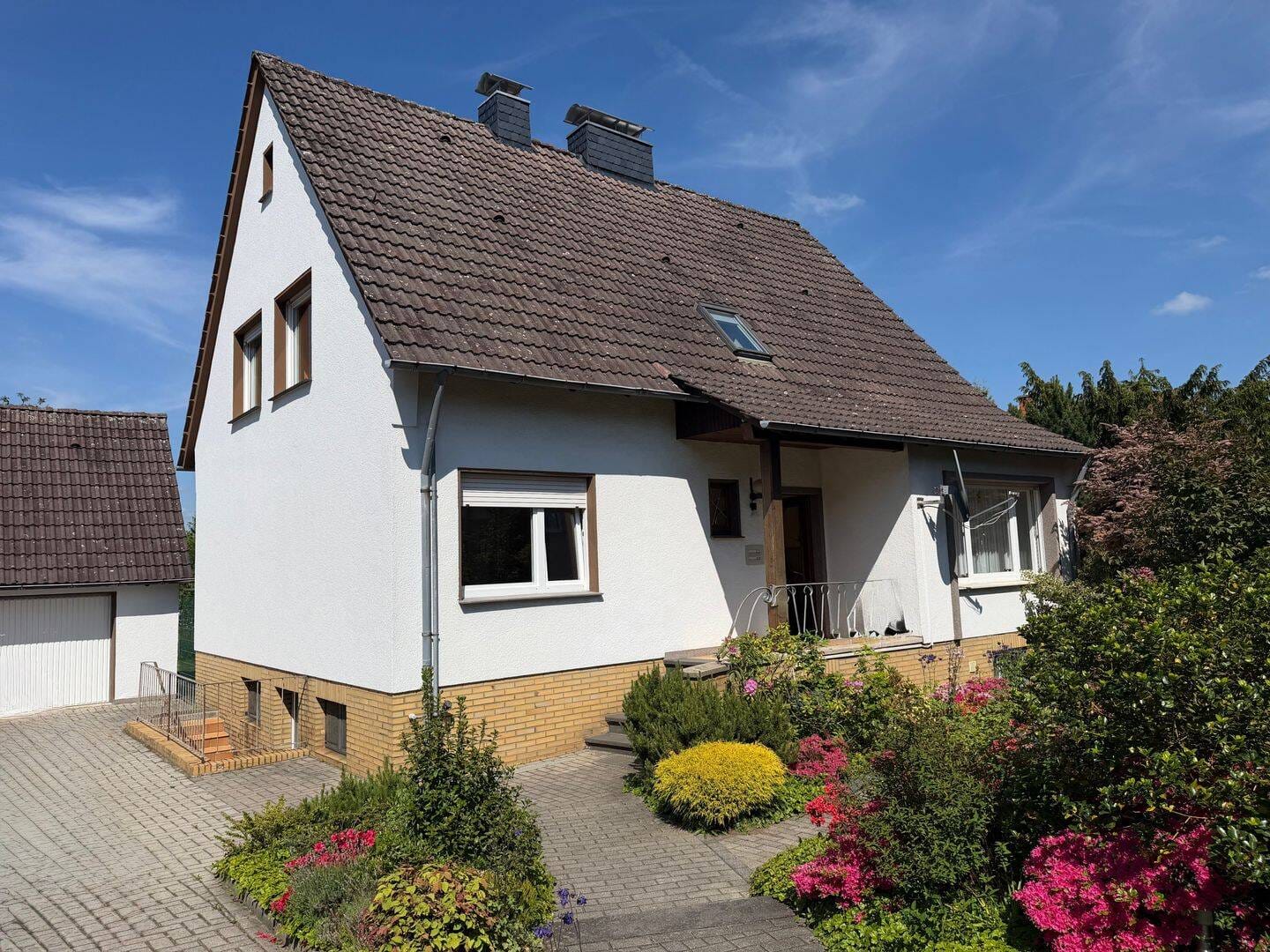 Immobilie in Hasbergen - Großzügiges Wohnhaus mit separater Wohneinheit, zwei Garagen und großem Grundstück in ruhiger Sackgassenlage - Bild 0