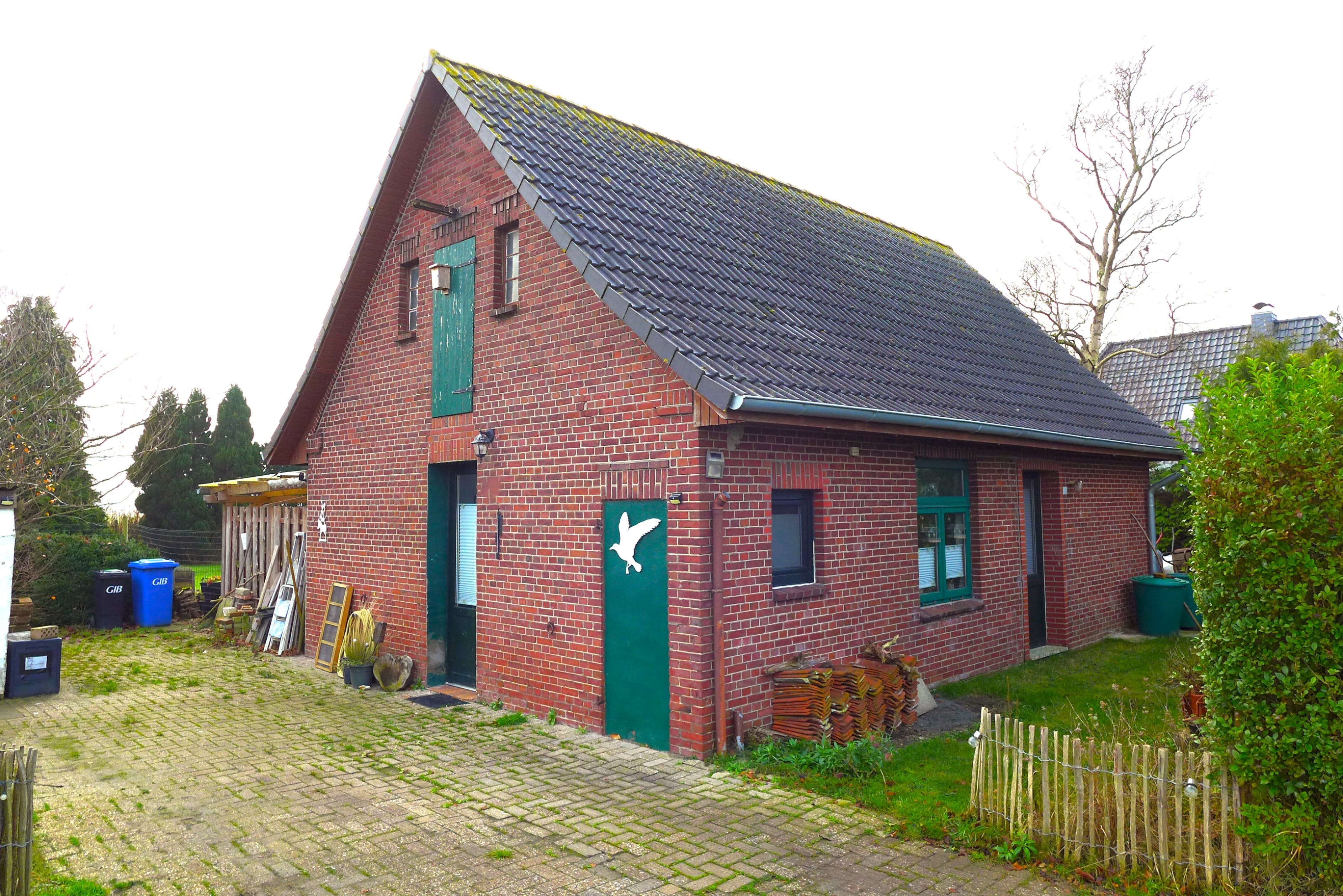 Immobilie in Ovelgönne - Kleines Haus mit Ausbaureserve und großem Garten - Bild 0