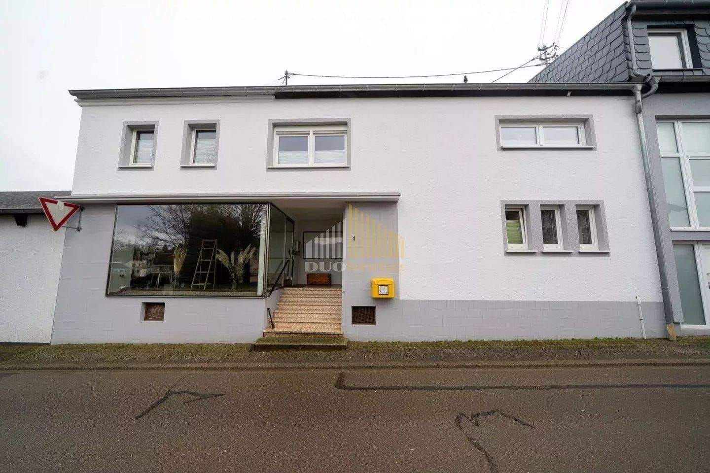 Immobilie in Ferschweiler - Wohn- und Geschäftshaus mit großem Innenhof und Ausbaupotenzial - Bild 0