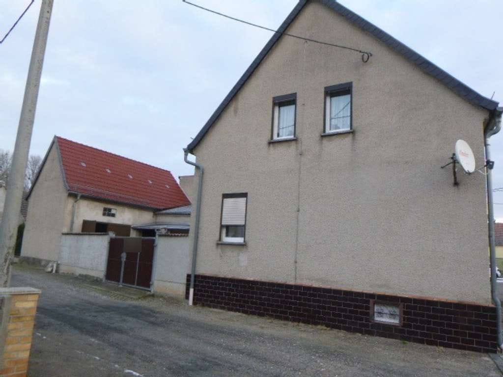 Immobilie in Dommitzsch - Reihenendhaus in ruhiger Stadtlage mit kleinem Garten und Nebengelass in Dommitzsch - Bild 1