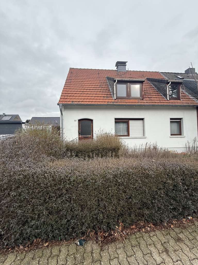 Immobilie in Rheinberg - Doppelhaushälfte mit Garten und Garage zu verkaufen 


 - Bild 0