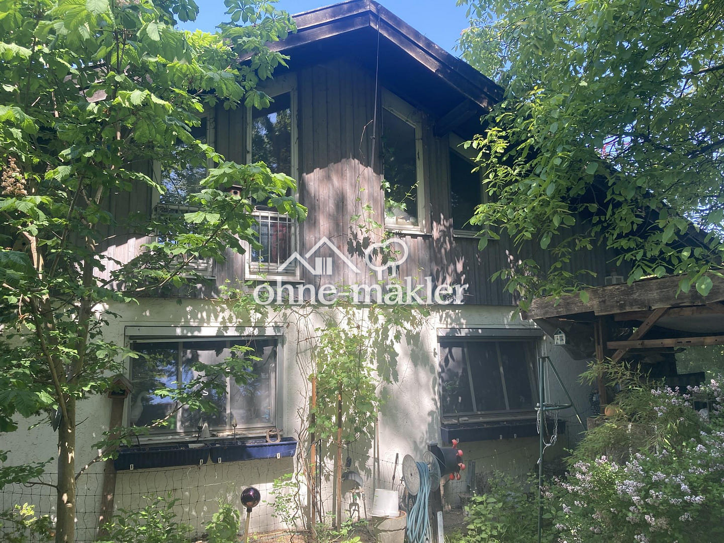 Immobilie in Huglfing - Einfamilienhaus mit 1078m² Grund und teilgewerblicher Nutzungsmöglichkeit in Huglfing - Bild 0