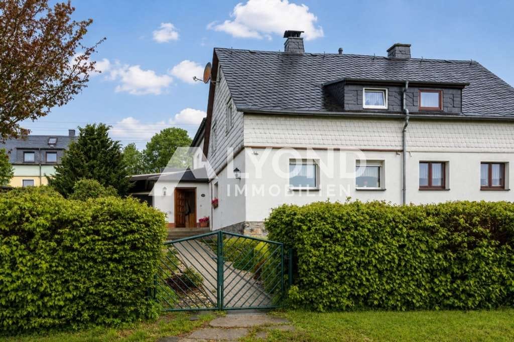 Immobilie in Großhartmannsdorf - Gepflegte Doppelhaushälfte mit großem Garten, Nebengelass & vielseitigen Außenbereichen - Bild 1