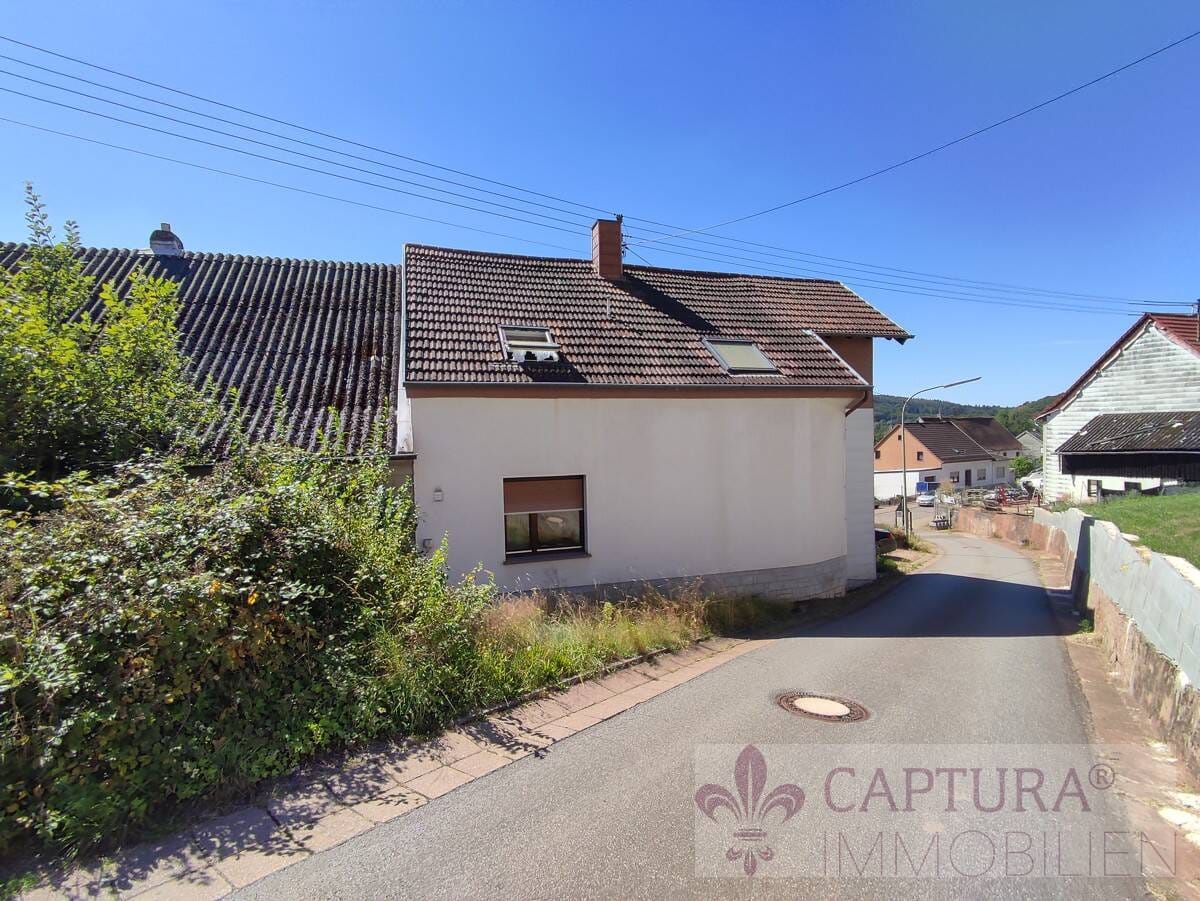 Immobilie in Eppelborn - Idyllisches Ein-Zweifamilienhaus mit Potenzial in ruhiger Lage von Eppelborn-Dirmingen! - Bild 1