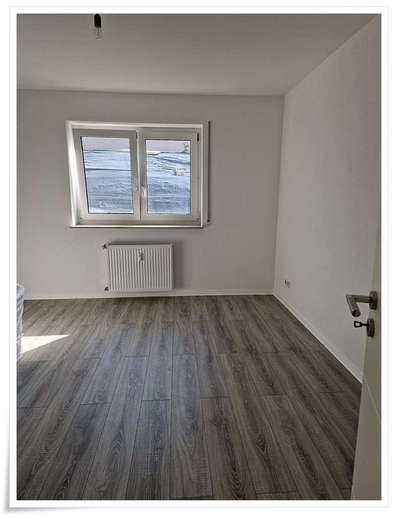 Immobilie in Eich - Erstbezug nach Kernsanierung 4 Zi.- Souterrain-Whg. -Ruhige Wohnlage- - Bild 4