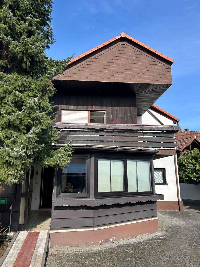Immobilie in Dettenheim - Solides und gepflegtes Einfamilienhaus mit Garten - Bild 1