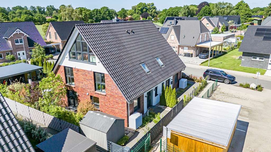 Immobilie in Kuddewörde - Moderne KfW-55-Doppelhaushälfte mit Carport für zwei PKW
in familienfreundlicher Wohnlage - Bild 2