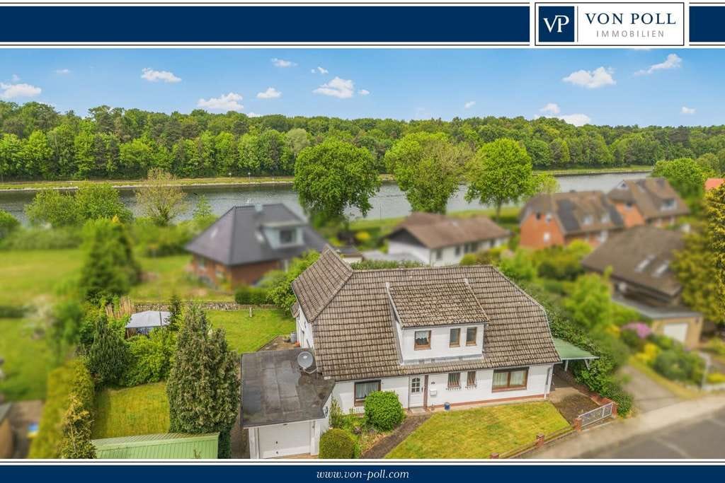 Immobilie in Westerrönfeld - Wohnen mit Schiffsverkehr: Charmantes Einfamilienhaus mit Einliegerwohnung am Nord-Ostsee-Kanal - Bild 0
