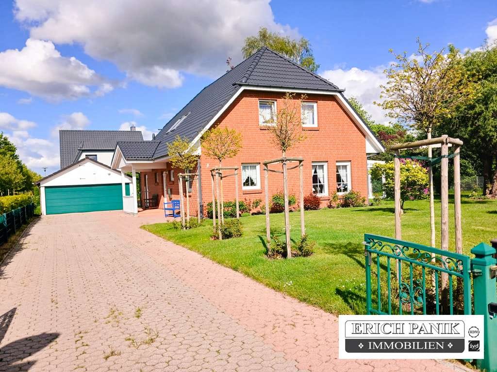 Immobilie in Bentwisch - Familienfreundliches Einfamilienhaus mit Wintergarten,  Doppelgarage & traumhaftem Garten  in Bentwi - Bild 0