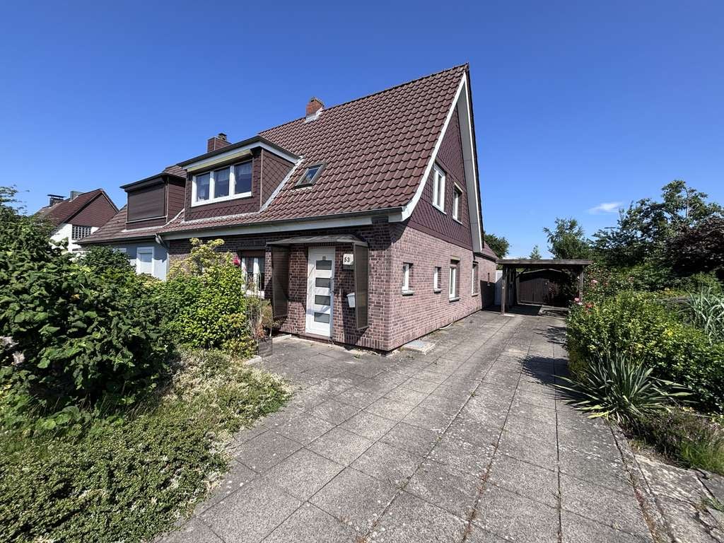 Immobilie in Nortorf - Modernisierte DHH mit neuem Dach, Wintergarten, Terrasse, Wallbox & Koi-Teich (Römbke Immobilien KG) - Bild 2