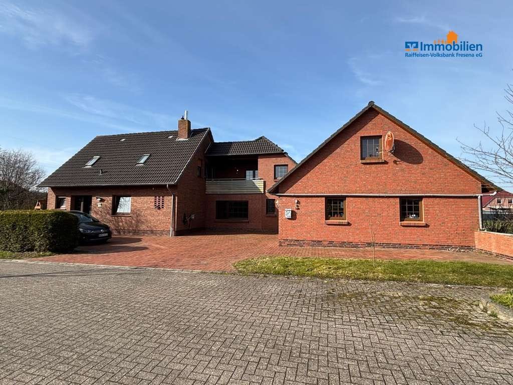 Immobilie in Großheide - Einfamilienhaus mit Einliegerwohnung in Sackgassenlage - Bild 0