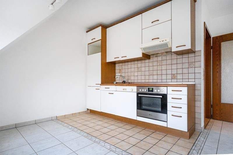 Immobilie in Esens - Zentral in Esens: Schöne Dachgeschosswohnung mit Balkon und Parkplatz! - Bild 3
