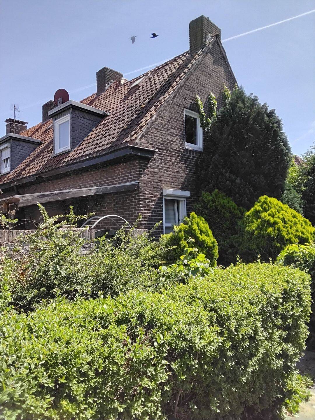 Immobilie in Gronau - ***BÜSCHER IMMOBILIEN*** Charmantes, denkmalgeschütztes, vermietetes, teilweise renoviertes und modernisiertes Reihenendhaus mit Garage - Bild 1
