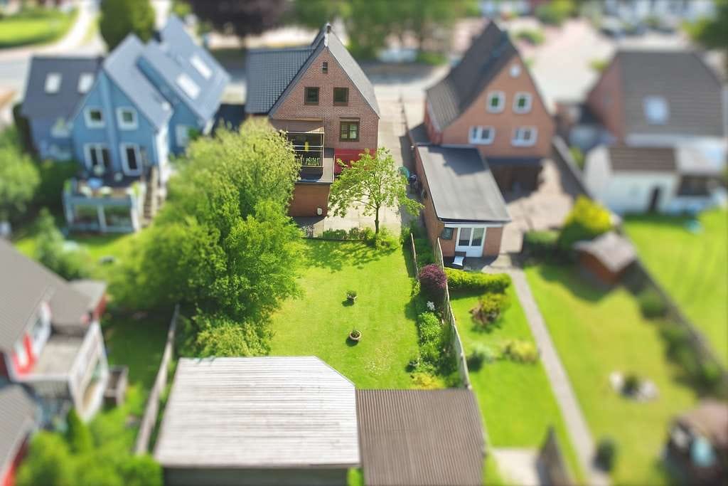 Immobilie in Harrislee - Einfamilienhaus im Zentrum mit rückliegender “grüner Oase“ - Bild 1