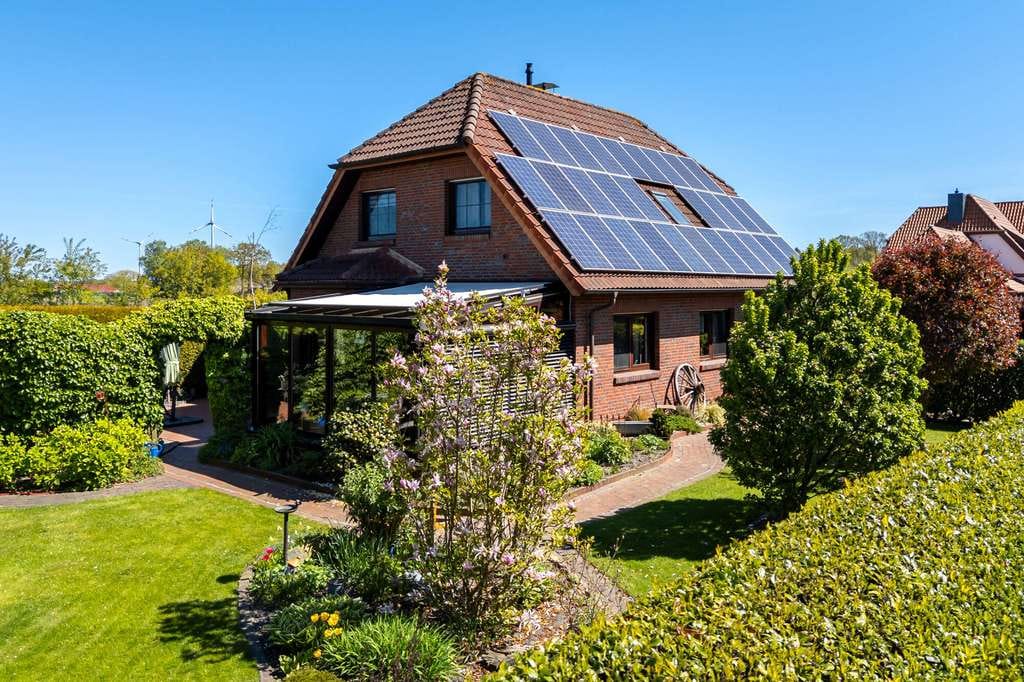 Immobilie in Saterland - Gemütliches Einfamilienhaus zum Wohlfühlen mit Wintergarten und idyllischem Außenbereich, Obj. 9722 - Bild 1