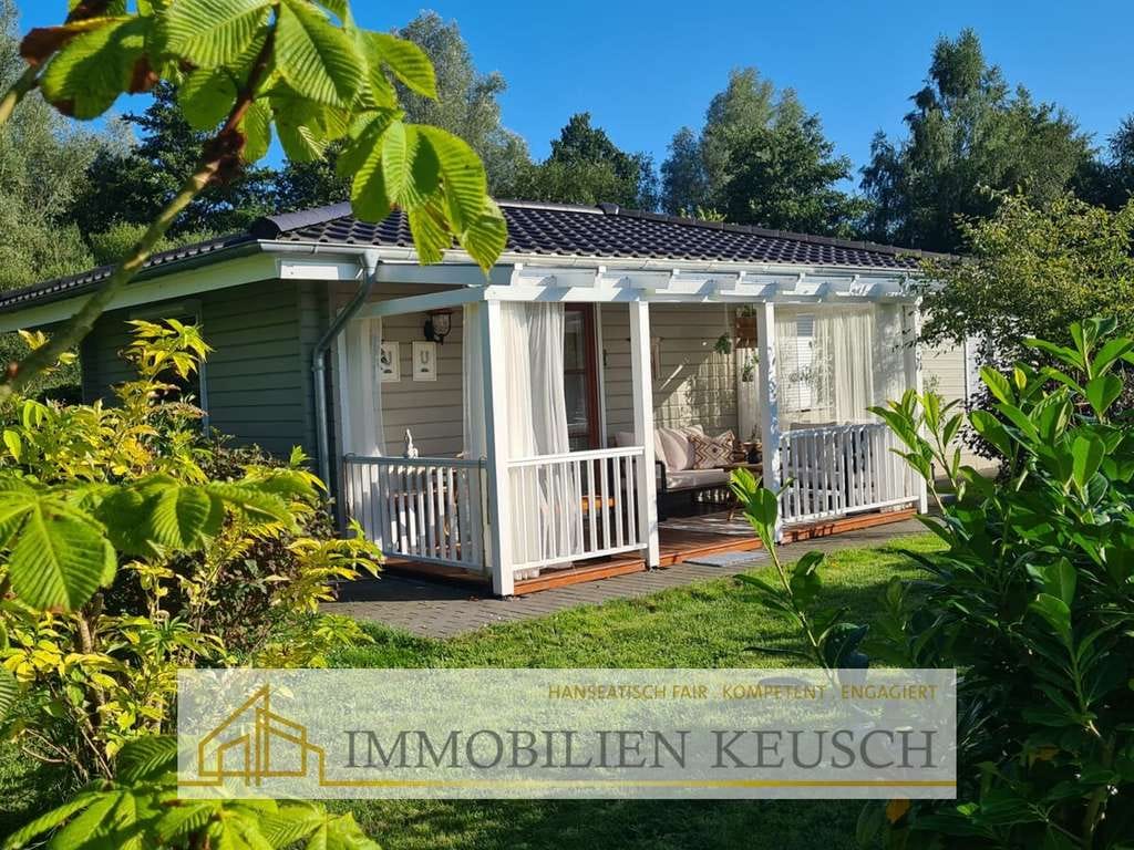 Immobilie in Vollersode - Traumhaftes und massiv gebautes Tiny House mit überdachter Terrasse & Schuppen in ruhiger Lage - Bild 0