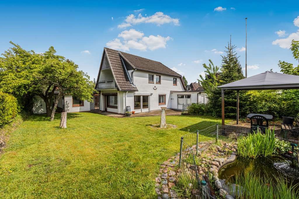 Immobilie in Westerrönfeld - Wohnen mit Schiffsverkehr: Charmantes Einfamilienhaus mit Einliegerwohnung am Nord-Ostsee-Kanal - Bild 1