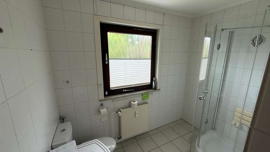 Immobilie in Pohlheim - Wohnung mit Haus-Charakter mit separatem Eingang, eigenem Garten und Garage mit direktem Zugang - Bild 1