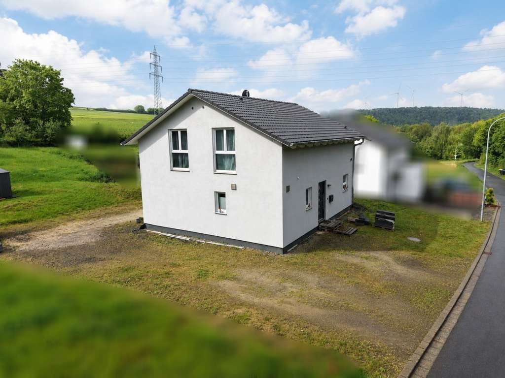Immobilie in Kollig - Großzügiges Grundstück in ruhiger Ortsrandlage – junge Immobilie mit Erdwärmepumpe! - Bild 2