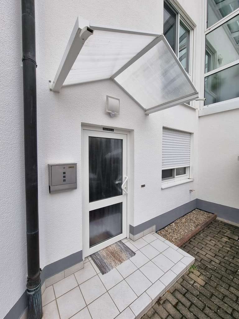 Immobilie in Burgrieden - 2-Zimmer Erdgeschosswohnung mit großem Wohnbereich, offener Küche und Garage - Bild 1