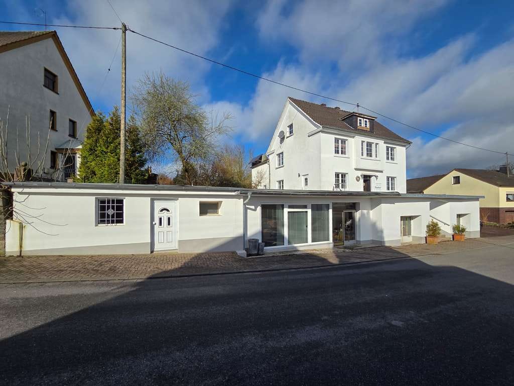 Immobilie in Birkenbeul - Mehrfamilienhaus mit großem Grundstück, ehemaligem Gewerbeteil und vielfältigem Entwicklungspotenzia - Bild 2