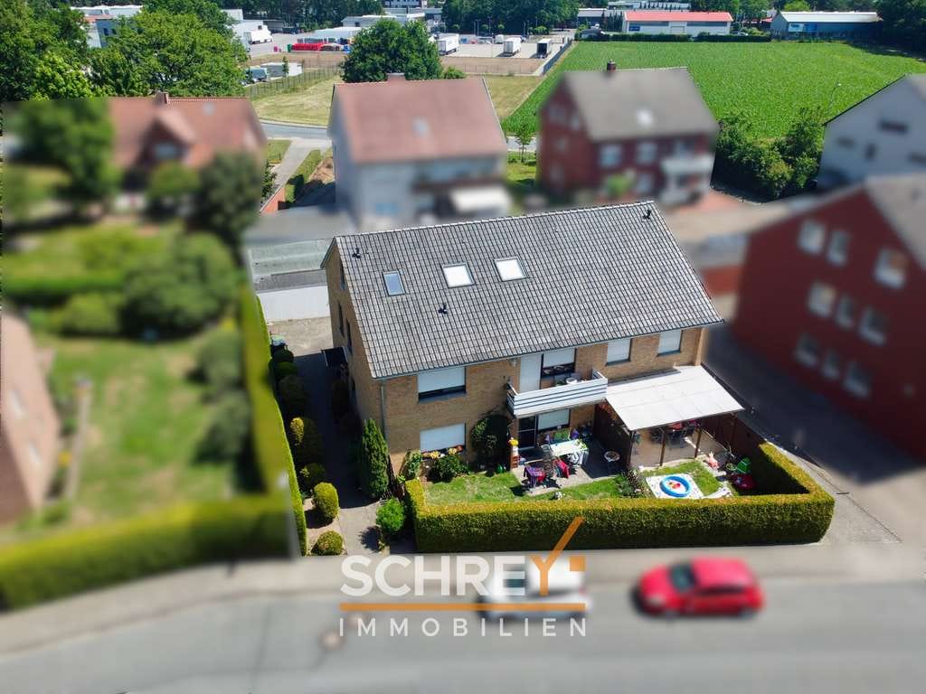 Immobilie in Wallenhorst - Renditestarkes Wohnobjekt mit 4 Parteien in Wallenhorst-Hollage - Bild 2