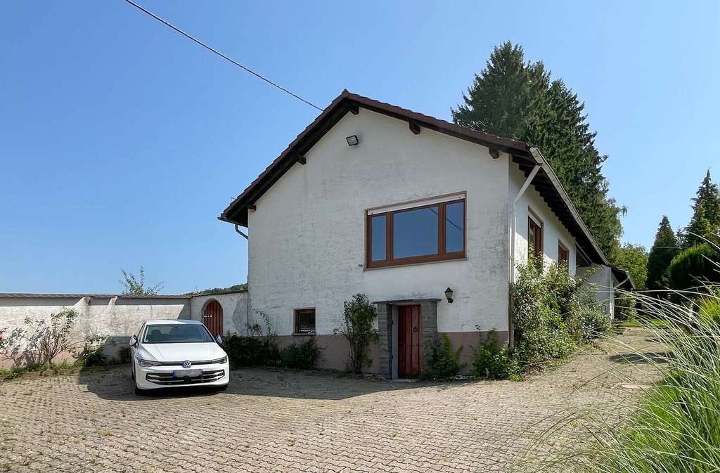 Immobilie in Mammelzen - Geräumiger Bungalow mit großem Grundstück und Doppelgarage am Ortsrand von Altenkirchen! - Bild 1