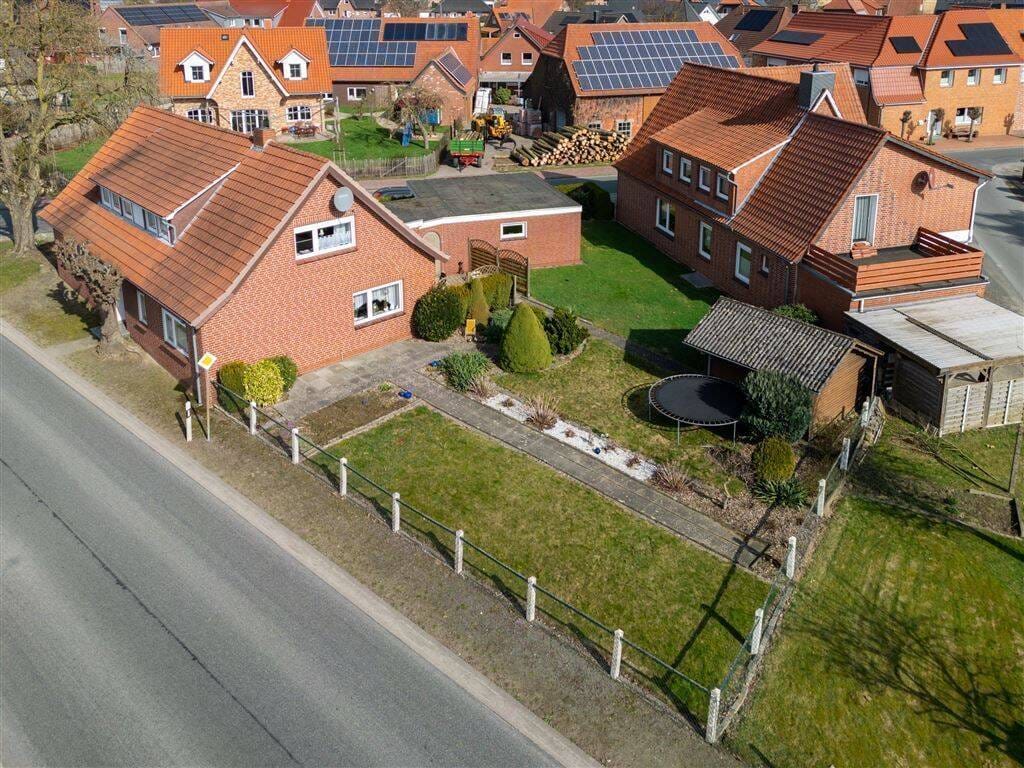 Immobilie in Twistringen - Charmantes Einfamilienhaus in guter Lage, mit Garage und Garten -- Platz zum Leben und zum Wohlfühlen für die ganze Familie! - Bild 2