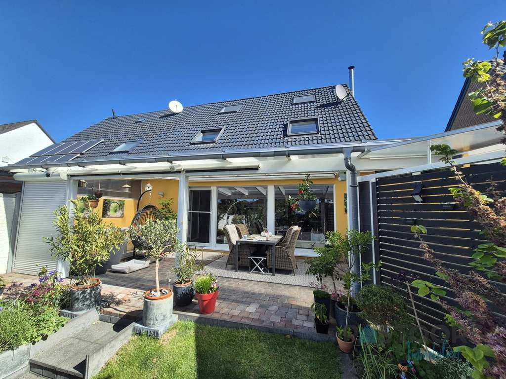 Immobilie in Sonsbeck - Mediterranes Wohngefühl in herrlich ruhiger Lage – gepflegte Doppelhaushälfte mit Wohlfühlgarten! - Bild 2
