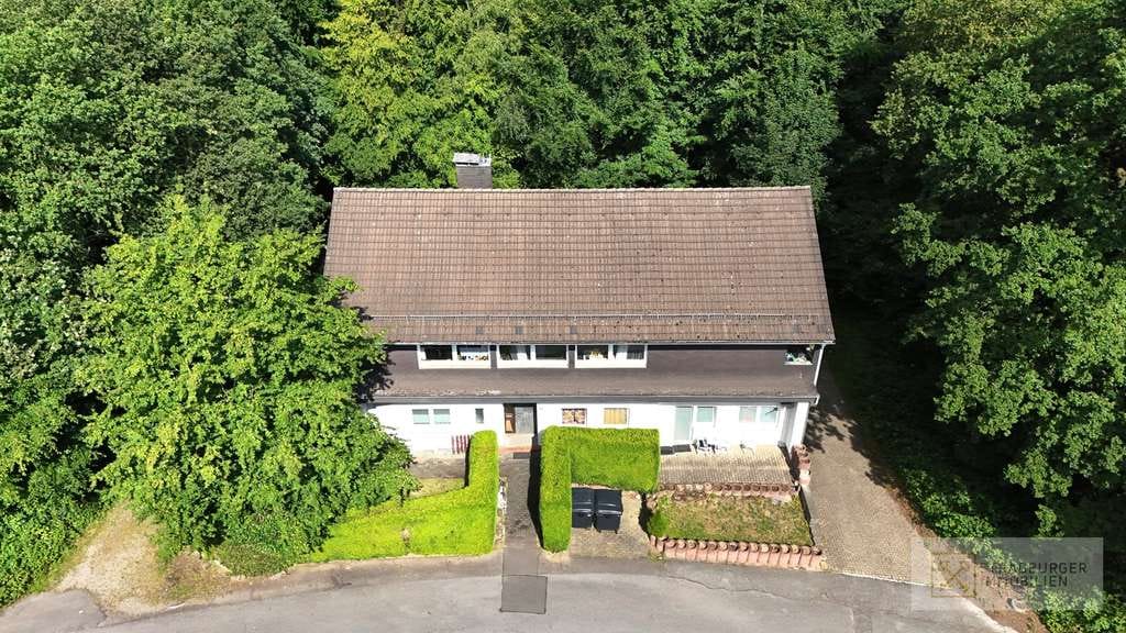 Immobilie in Wermelskirchen - Gepflegtes Vierparteienhaus mit Mietsteigerungspotential in ruhiger Waldrandlage von Wermelskirchen - Bild 0