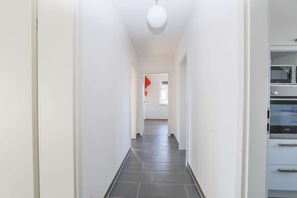 Immobilie in Korschenbroich - Charmante Maisonettewohnung mit modernem Wohnkomfort, Balkon und Garage in Glehn - Bild 2