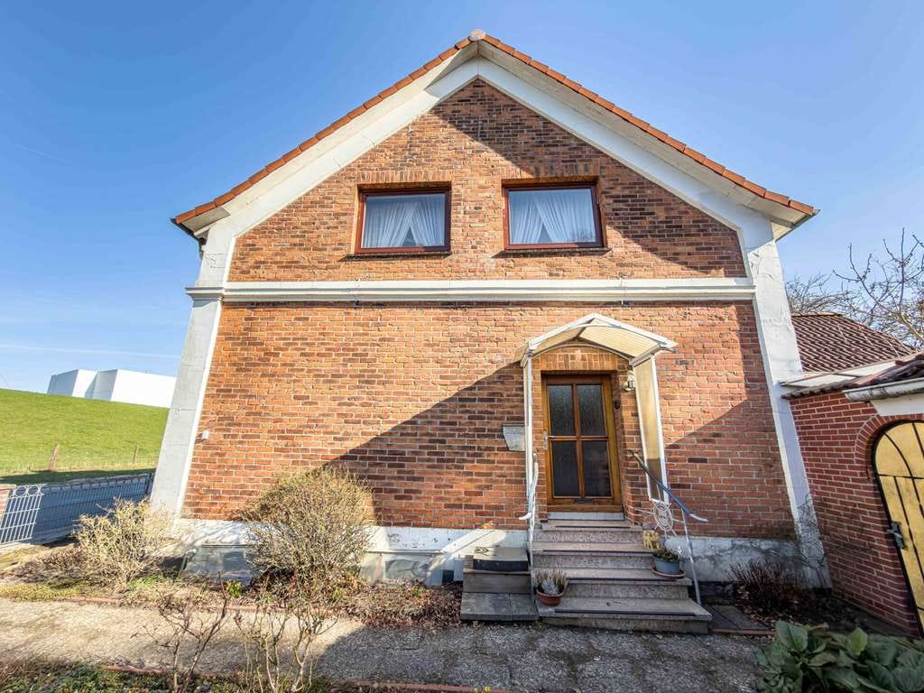 Immobilie in Lemwerder - Flexibles Mehrgenerationenhaus mit weitläufigem Garten und Garage - Bild 1