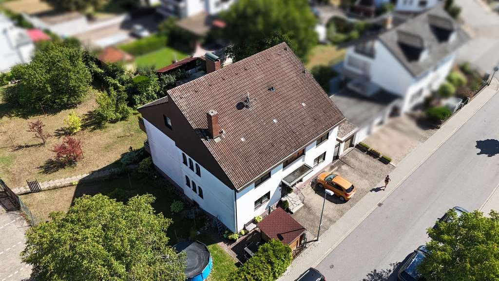 Immobilie in Sandhausen - Großzügiges 3-Familienhaus in ruhiger Lage mit Ausbaupotenzial im DG +1 WE - Bild 2