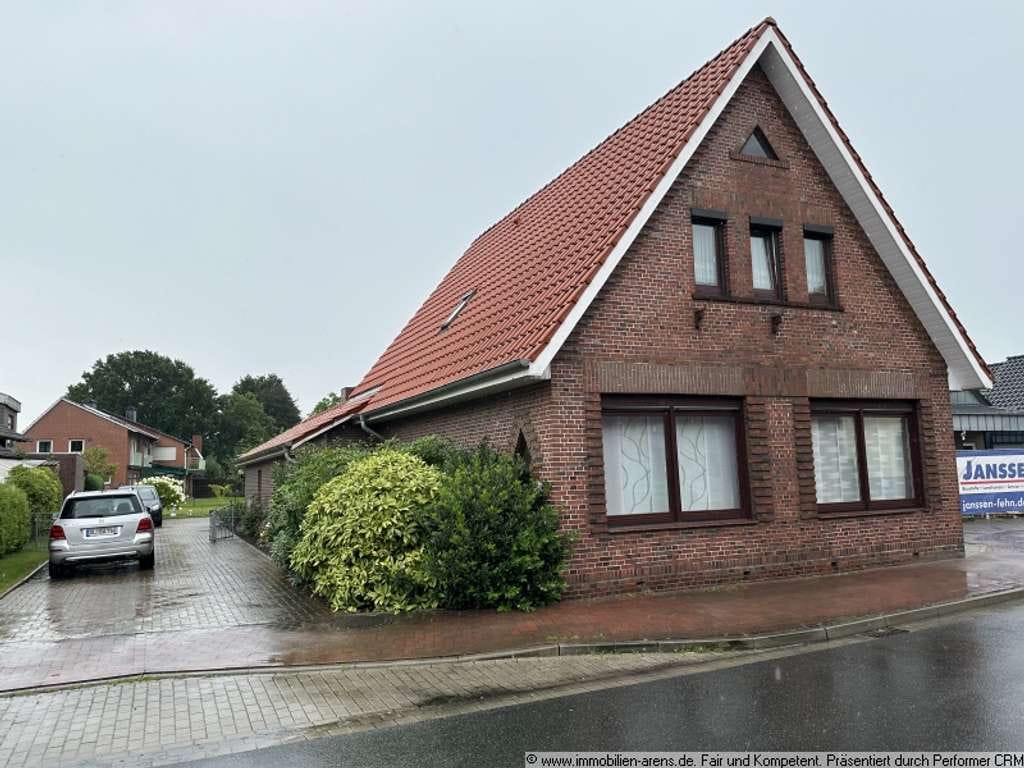 Immobilie in Apen - solides Klinkergebäude mit Garage und Wintergarten in Apen - Bild 1